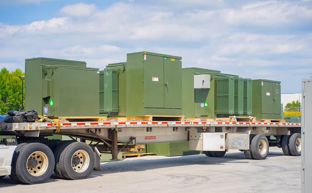 A group of padmount transformers loaded into a truck